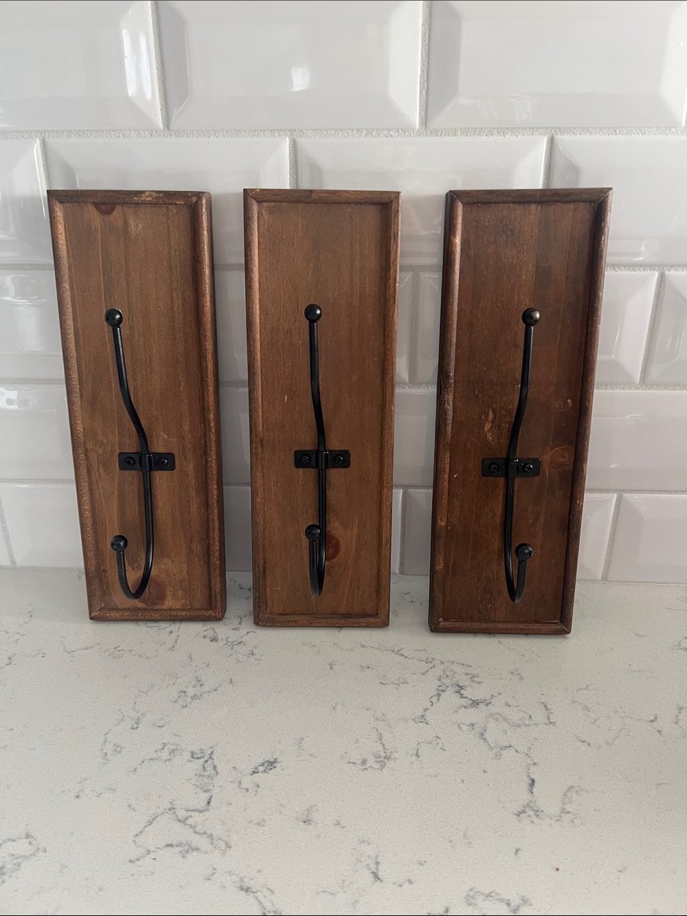 Three wooden wall hanger hooks